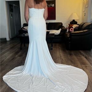 New Wedding dress, never used. Size 10. Designer Theia Couture.